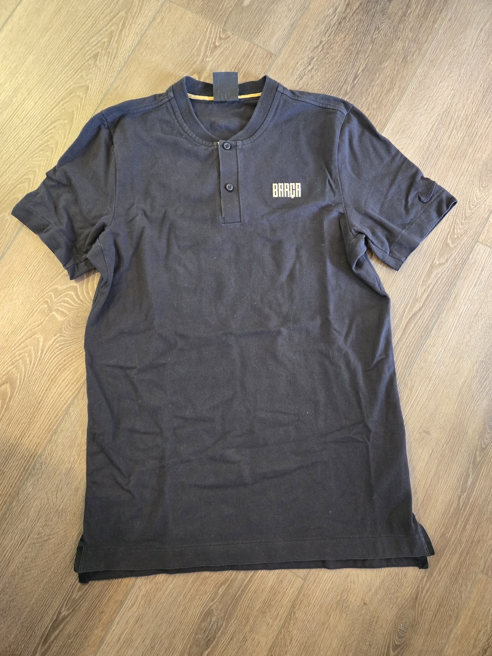 Nike Men's Black Short-Sleeve Henley Polo with Gold Logo
